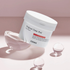 COSRX One Step Original Clear Pad - jar on pink background with glass spheres
